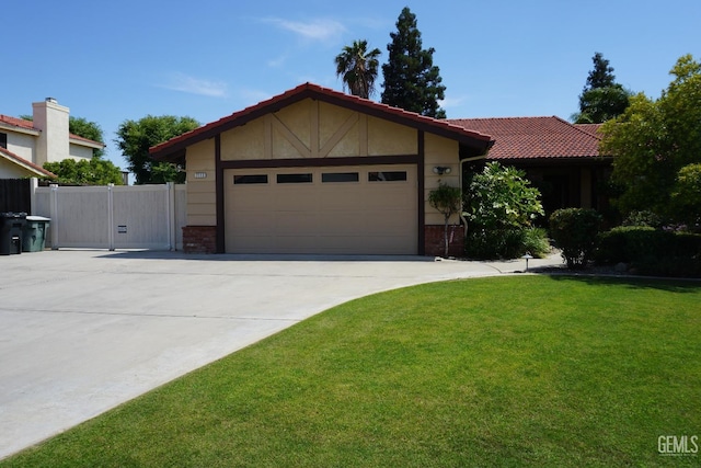 ranch-style home featuring brick siding, a garage, driveway, and a front yard