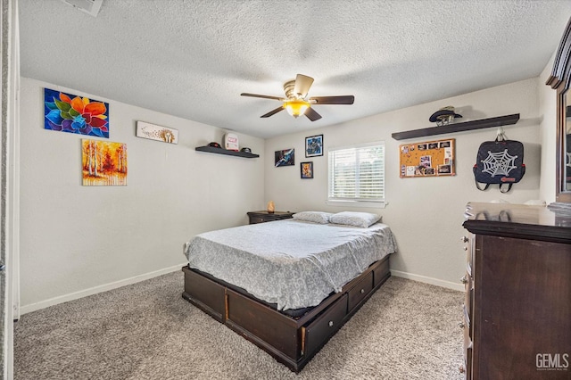 404 Colusa Ave, Chowchilla, CA 93610 - bedroom with baseboards, light colored carpet, ceiling fan, and a textured ceiling
