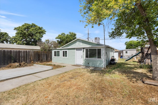 404 Colusa Ave, Chowchilla, CA 93610 - view of front of house with a playground