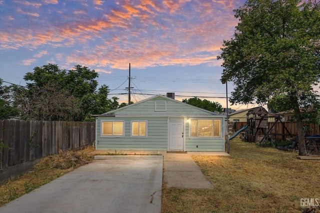 404 Colusa Ave, Chowchilla, CA 93610 - bungalow-style house with a playground