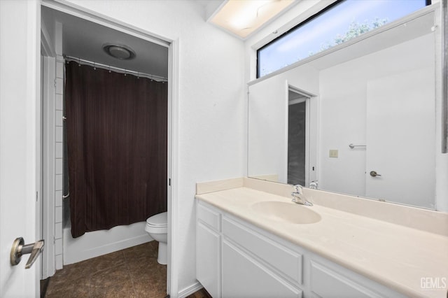 full bathroom featuring shower / bath combo, vanity, tile patterned floors, and toilet