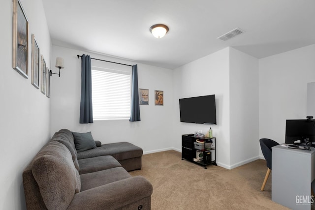 living area featuring light carpet, visible vents, and baseboards