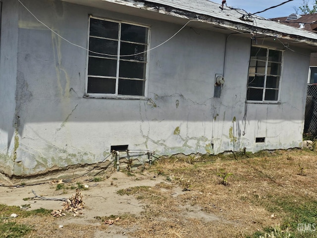view of side of home with crawl space