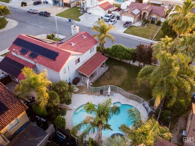 birds eye view of property with a residential view