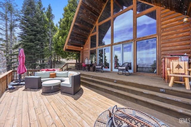 wooden terrace with an outdoor hangout area
