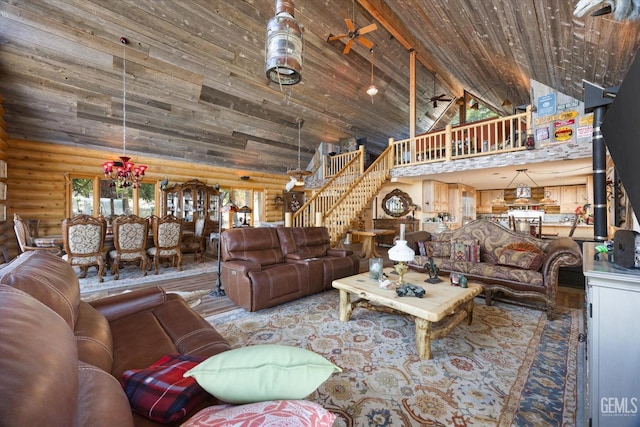 living area with log walls, high vaulted ceiling, stairway, and wood ceiling