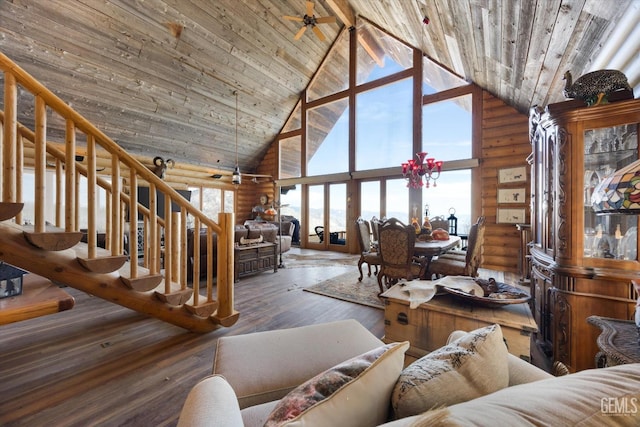 living area featuring high vaulted ceiling, rustic walls, hardwood / wood-style floors, and wood ceiling