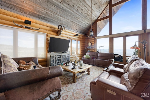 living area featuring high vaulted ceiling and log walls