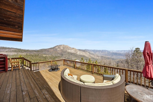 wooden deck with a mountain view