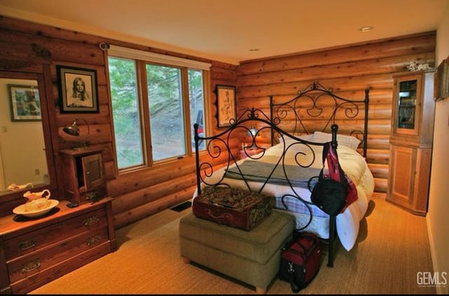 carpeted bedroom featuring visible vents