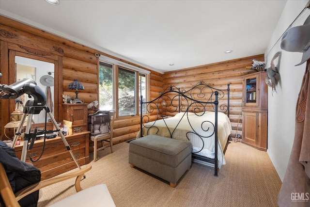 bedroom with log walls, light colored carpet, baseboards, and recessed lighting