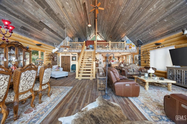 living room featuring rustic walls, wood finished floors, stairway, and wood ceiling