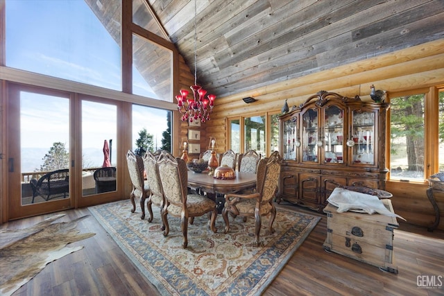 dining room featuring french doors, log walls, high vaulted ceiling, and a wealth of natural light