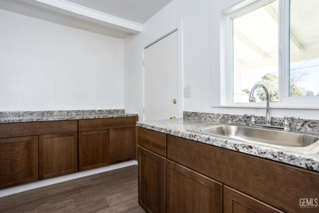 kitchen featuring dark hardwood / wood-style floors and sink