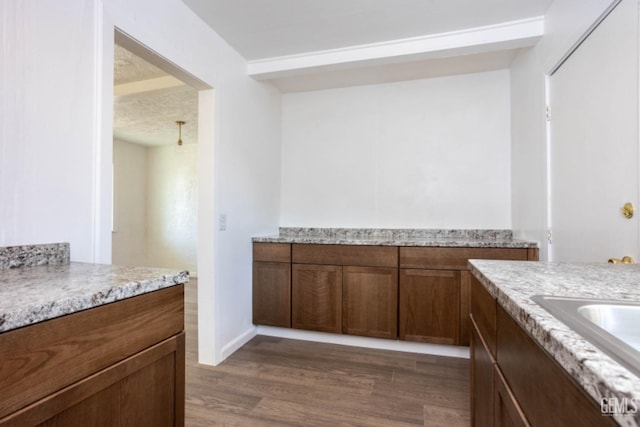 bathroom featuring sink and hardwood / wood-style floors