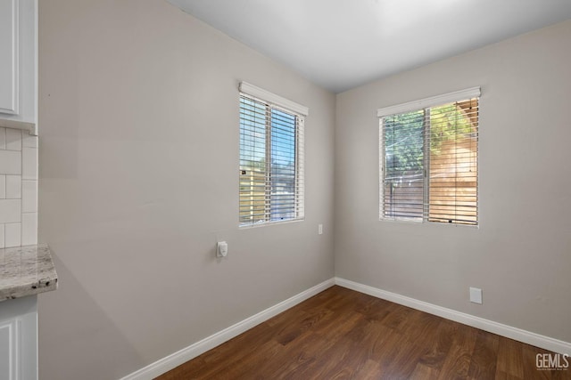 2613 Spruce St, Bakersfield, CA 93301 - empty room featuring wood finished floors and baseboards