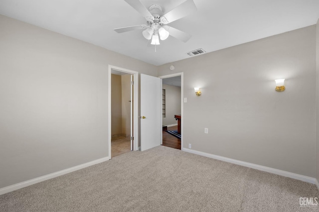 2613 Spruce St, Bakersfield, CA 93301 - unfurnished bedroom with carpet flooring, baseboards, and a ceiling fan