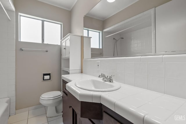 2613 Spruce St, Bakersfield, CA 93301 - bathroom with toilet, tile patterned flooring, vanity, tasteful backsplash, and  shower combination