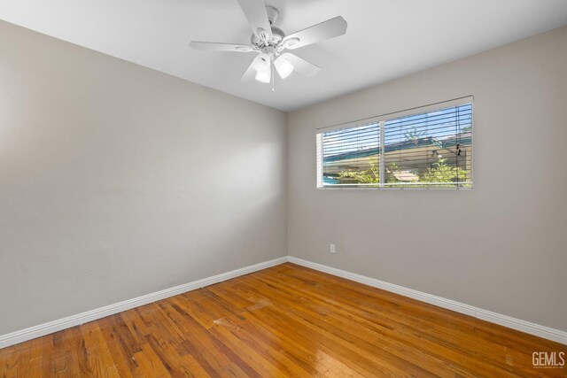 2613 Spruce St, Bakersfield, CA 93301 - spare room with baseboards, wood finished floors, and ceiling fan