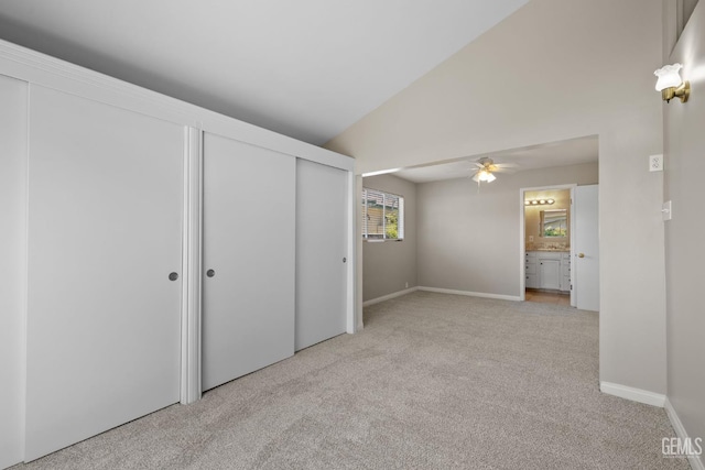 2613 Spruce St, Bakersfield, CA 93301 - unfurnished bedroom featuring light colored carpet, lofted ceiling, and baseboards