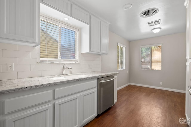 2613 Spruce St, Bakersfield, CA 93301 - kitchen featuring dishwasher, a sink, dark wood-type flooring, baseboards, and decorative backsplash