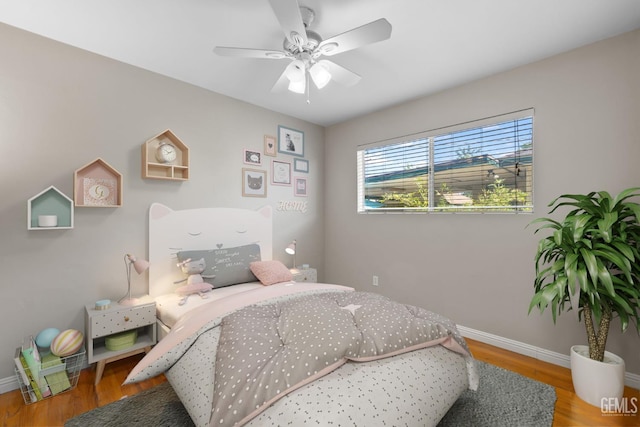 2613 Spruce St, Bakersfield, CA 93301 - bedroom with wood finished floors, baseboards, and ceiling fan