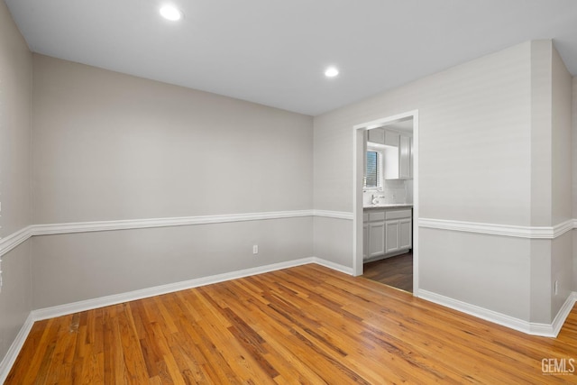 2613 Spruce St, Bakersfield, CA 93301 - empty room featuring light wood finished floors, baseboards, and recessed lighting