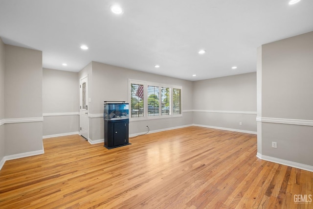 2613 Spruce St, Bakersfield, CA 93301 - unfurnished living room featuring light wood finished floors, baseboards, and recessed lighting