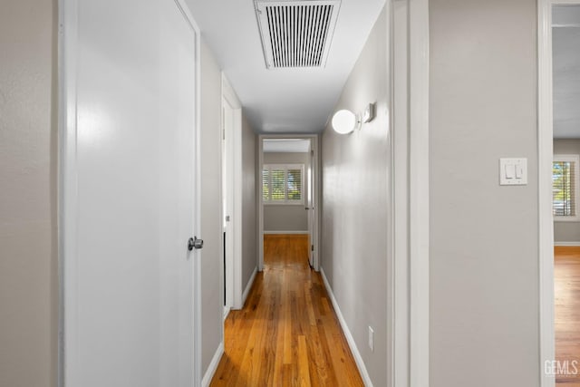 2613 Spruce St, Bakersfield, CA 93301 - hallway featuring light wood-style flooring and baseboards