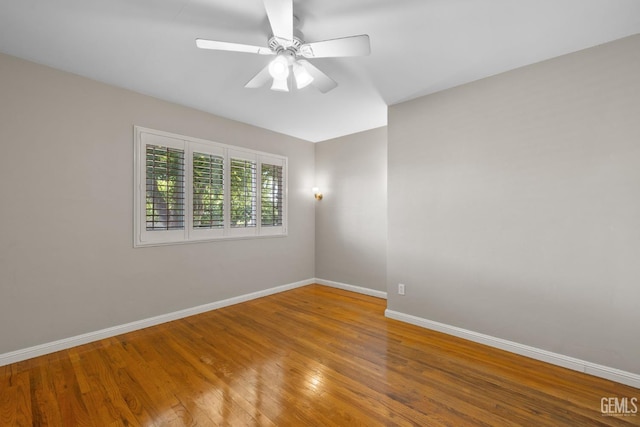2613 Spruce St, Bakersfield, CA 93301 - empty room featuring baseboards, a ceiling fan, and wood finished floors