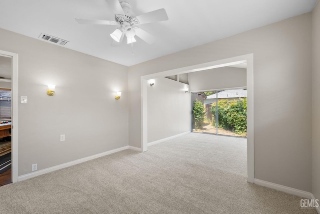 2613 Spruce St, Bakersfield, CA 93301 - carpeted spare room with baseboards and a ceiling fan