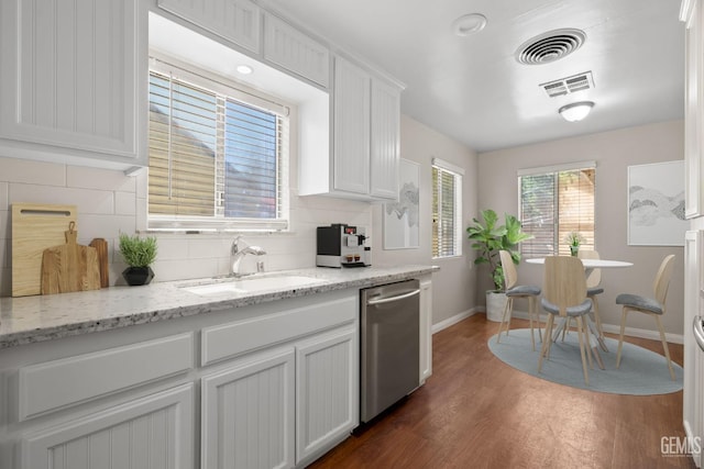 2613 Spruce St, Bakersfield, CA 93301 - kitchen with dishwasher, a sink, baseboards, dark wood-style flooring, and tasteful backsplash