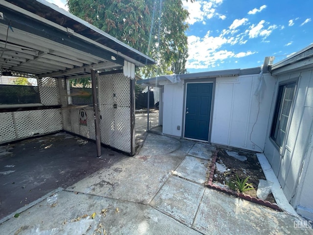 view of patio featuring a storage unit