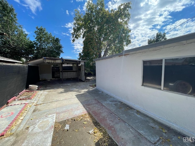 view of property exterior with a patio