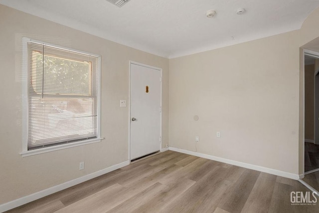 spare room with light wood-type flooring