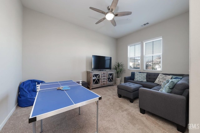 playroom with light carpet and ceiling fan