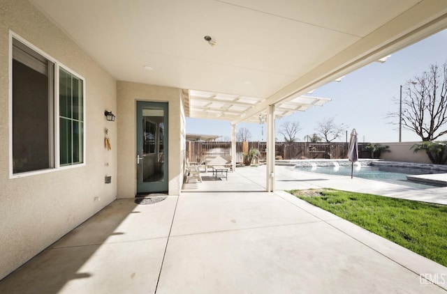 view of patio / terrace featuring a fenced in pool