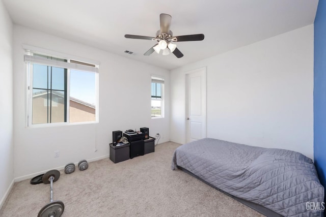 carpeted bedroom with ceiling fan