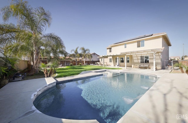 view of pool with a pergola, a lawn, and a patio