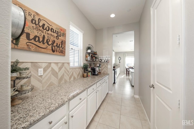 hallway with light tile patterned floors