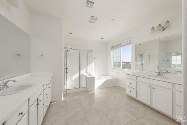 bathroom with vanity, independent shower and bath, and tile patterned flooring