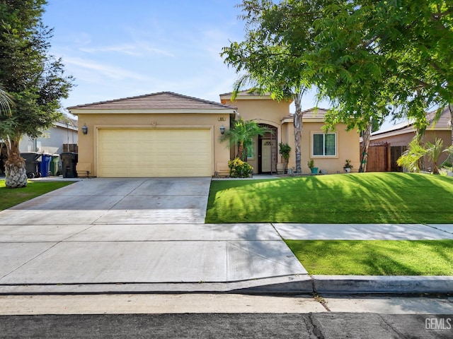 605 Cornelia St, Wasco, CA 93280 - view of front of property with stucco siding, driveway, a garage, and a tiled roof
