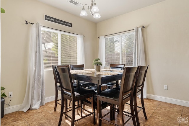 605 Cornelia St, Wasco, CA 93280 - dining area featuring plenty of natural light, a chandelier, and light tile patterned floors