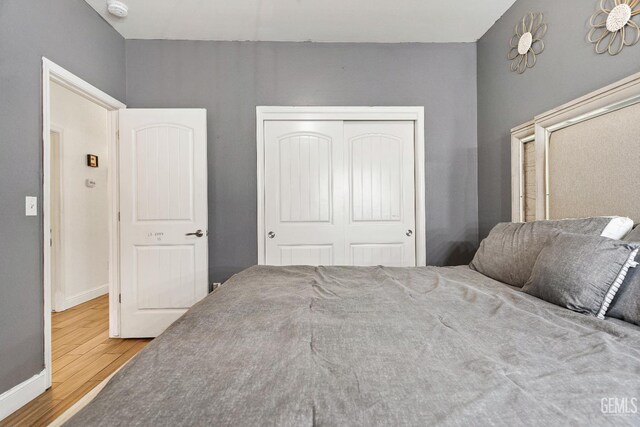 605 Cornelia St, Wasco, CA 93280 - bedroom featuring wood finished floors and a closet