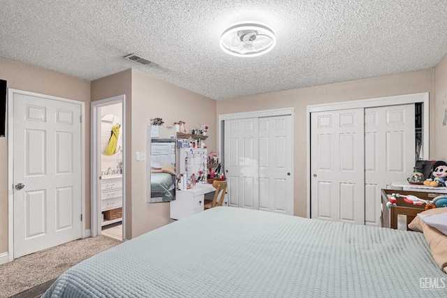 5104 Silver Crossing St, Bakersfield, CA 93313 - bedroom featuring two closets, carpet floors, a textured ceiling, and baseboards