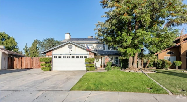 5104 Silver Crossing St, Bakersfield, CA 93313 - traditional-style home featuring roof mounted solar panels, concrete driveway, an attached garage, a chimney, and stucco siding