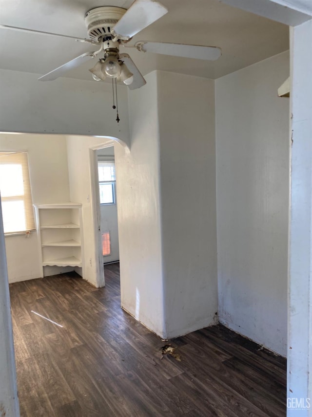 spare room with ceiling fan and dark hardwood / wood-style flooring