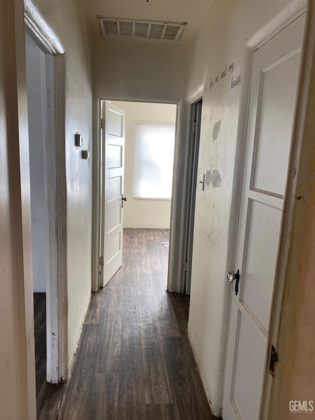 corridor with dark hardwood / wood-style floors