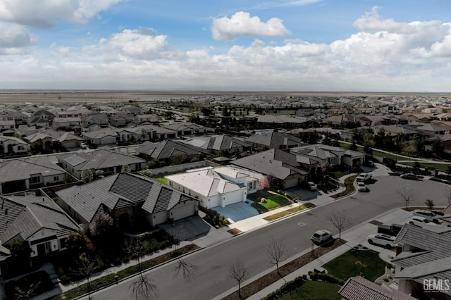 birds eye view of property with a residential view