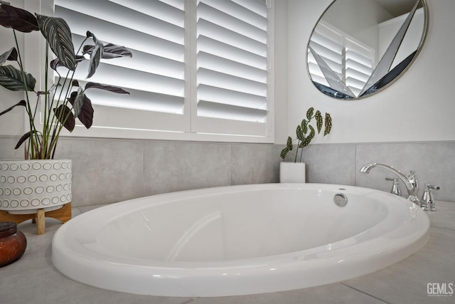 bathroom featuring a washtub